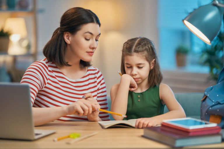 Spanish tutor and smiling child