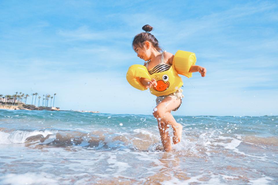 Little Playing On The Beach