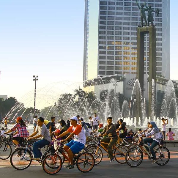 People Riding A Bike At Car Free Day In Jakarta