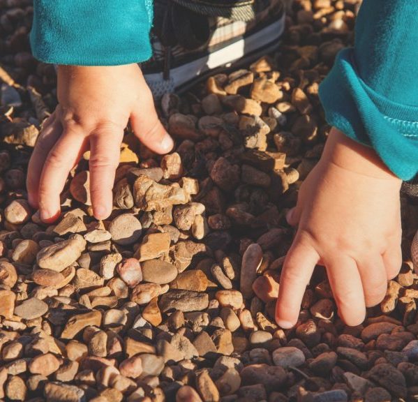 Child Holding Rocks