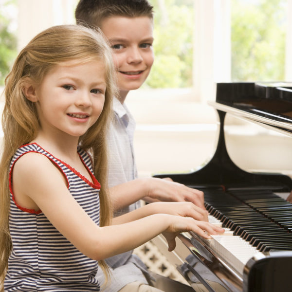 Children Playing The Piano