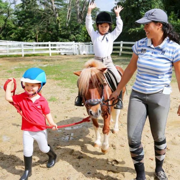 Children Walking And Riding A Horse At National Equestrian Centre Singapore