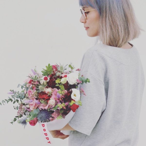 Woman Holding A Bouquet By Poppy Flora Studio Singapore