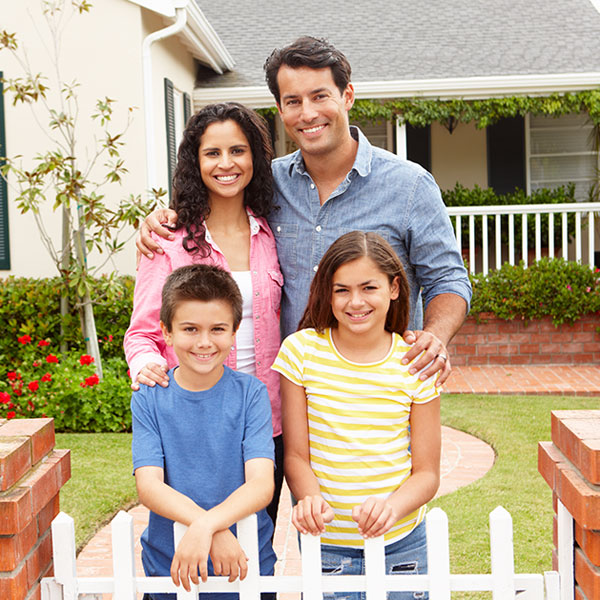 Happy Family Outside House