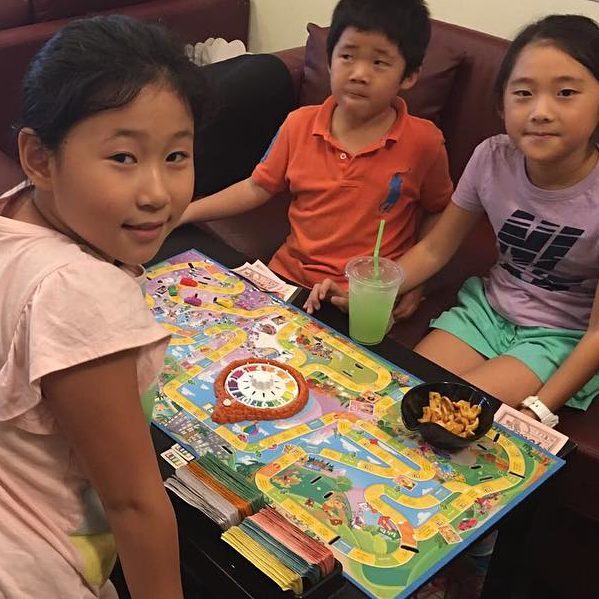 Children Playing A Board Game At The Mind Café Singapore