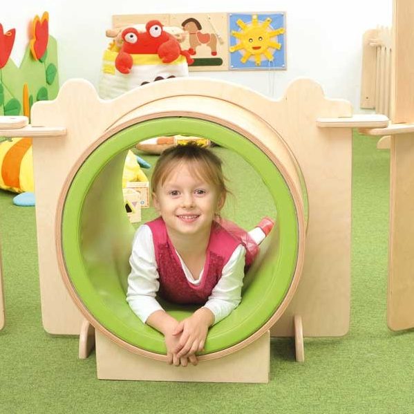 Toddler Playing In A Tunnel At Toddlers Town Montessori-Based Day Care: South Jakarta