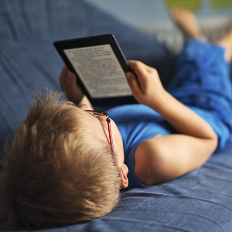 Kid Reading Kindle