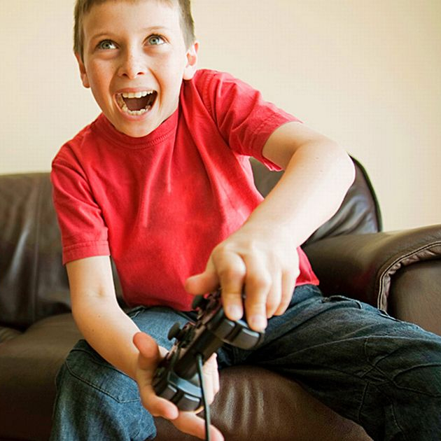 Kid playing PS4