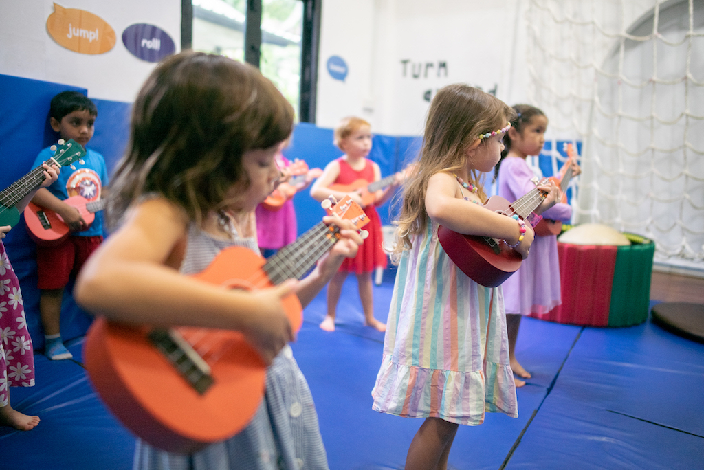 Playing Ukelele White Lodge Singapore